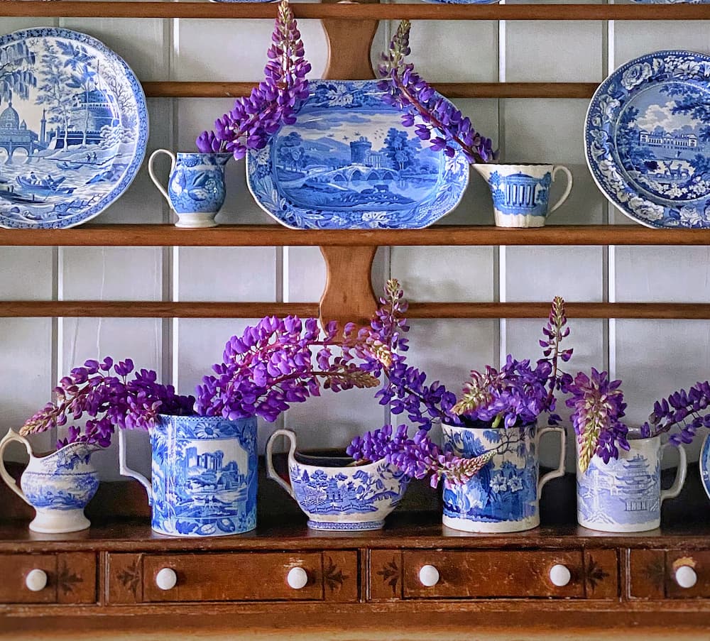 Blue and white dishes with lupine