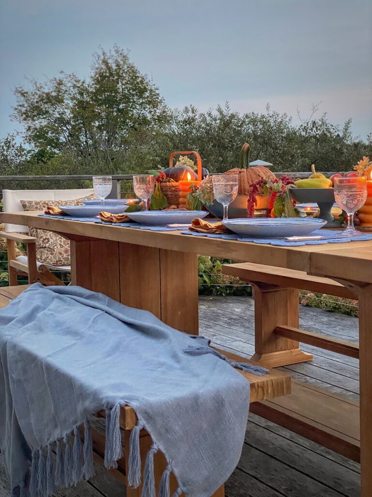 https://mollyinmaine.com/wp-content/uploads/2023/10/An-Outdoor-Harvest-Table-Set-With-Falls-Bounty-20-768x1024.jpg