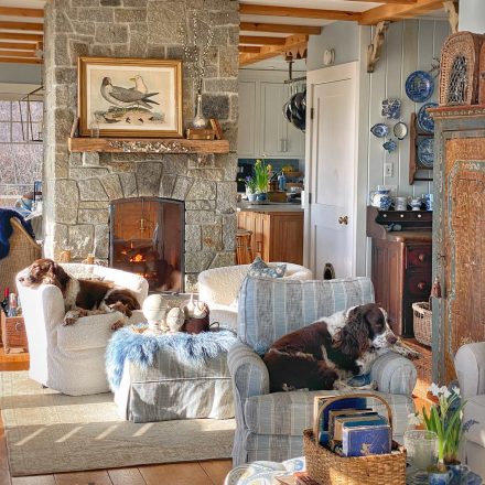 Maine cottage living room with slipcovers and swivel chairs in blue and white.